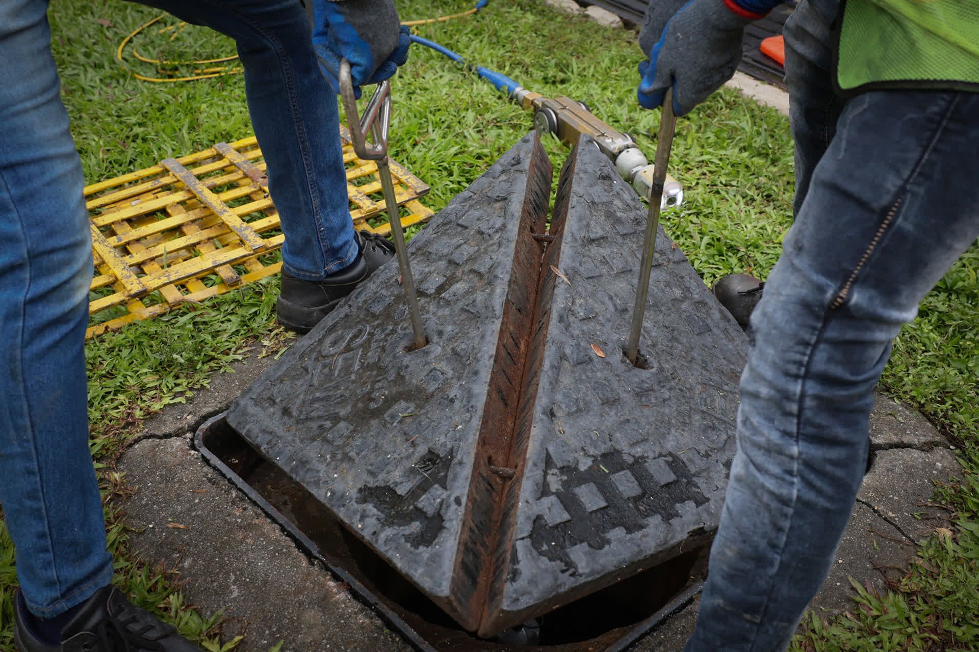 On average, a sewer manhole cover weighs around 70kg and requires at least two men using tools to lift it.