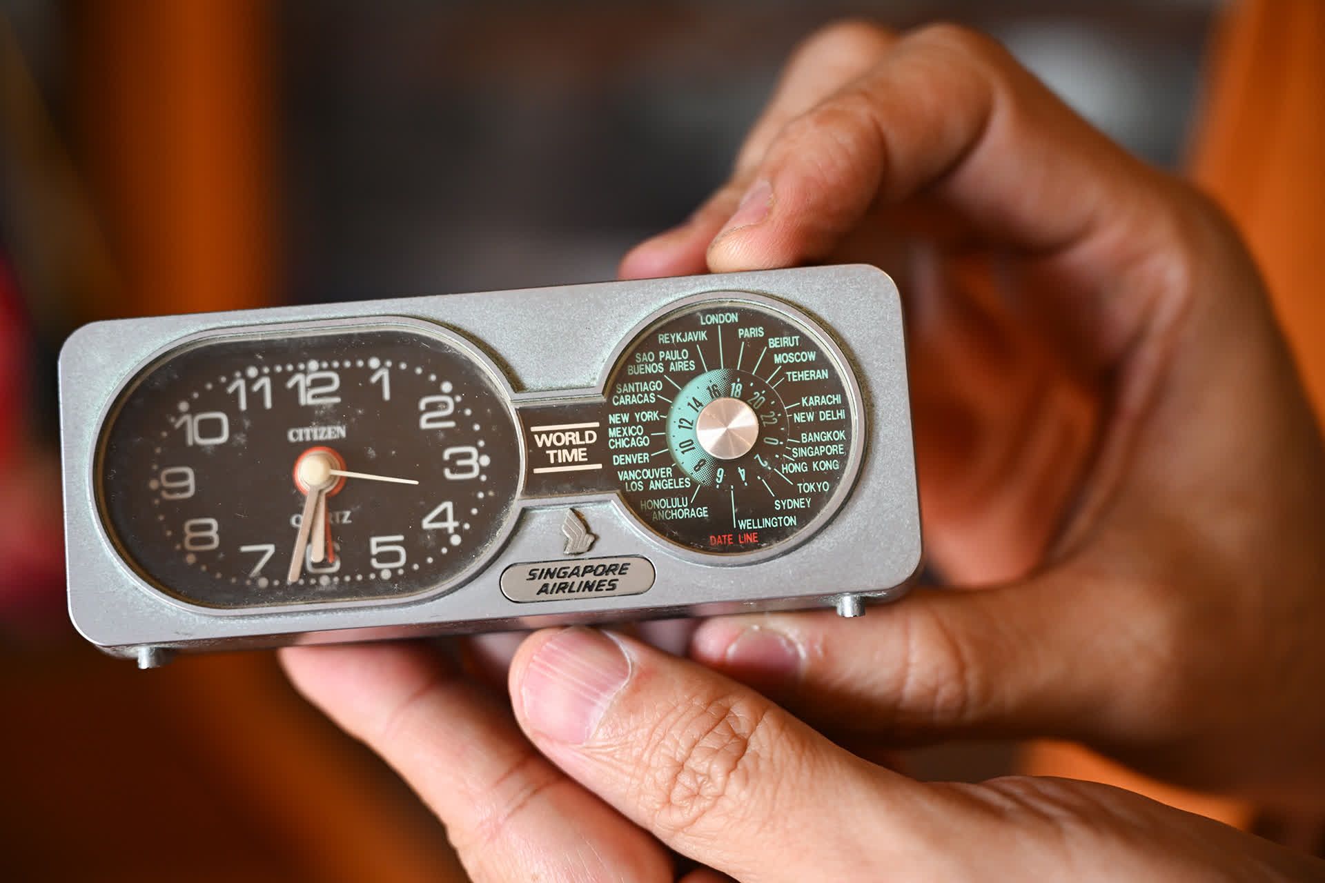 A table clock used by Dr Ong's father when he was an employee with SIA. The clock allows one to read the time in other countries.