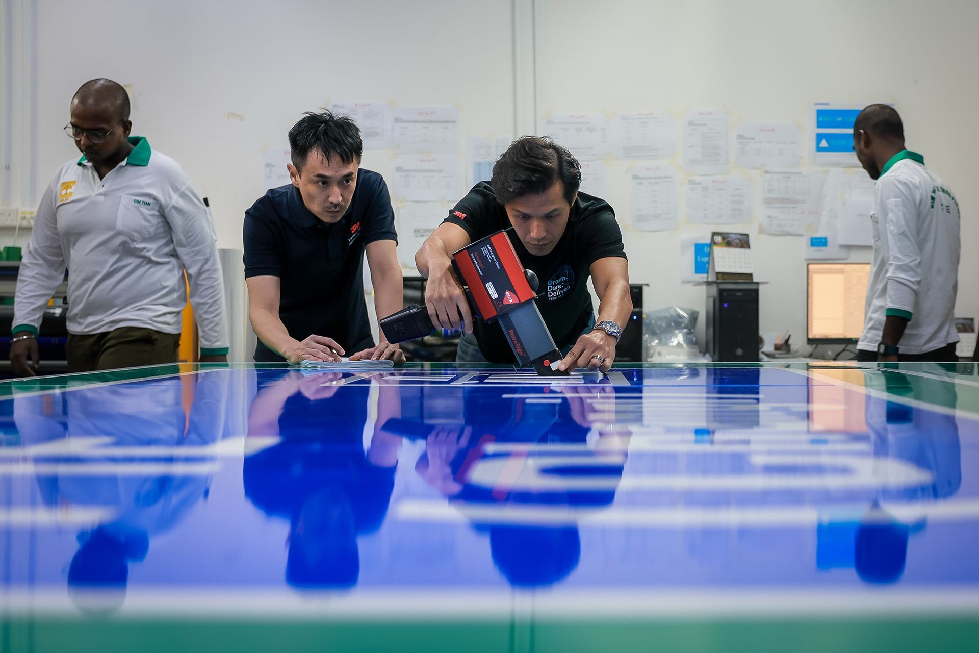 A supplier using a handheld retroreflectometer.