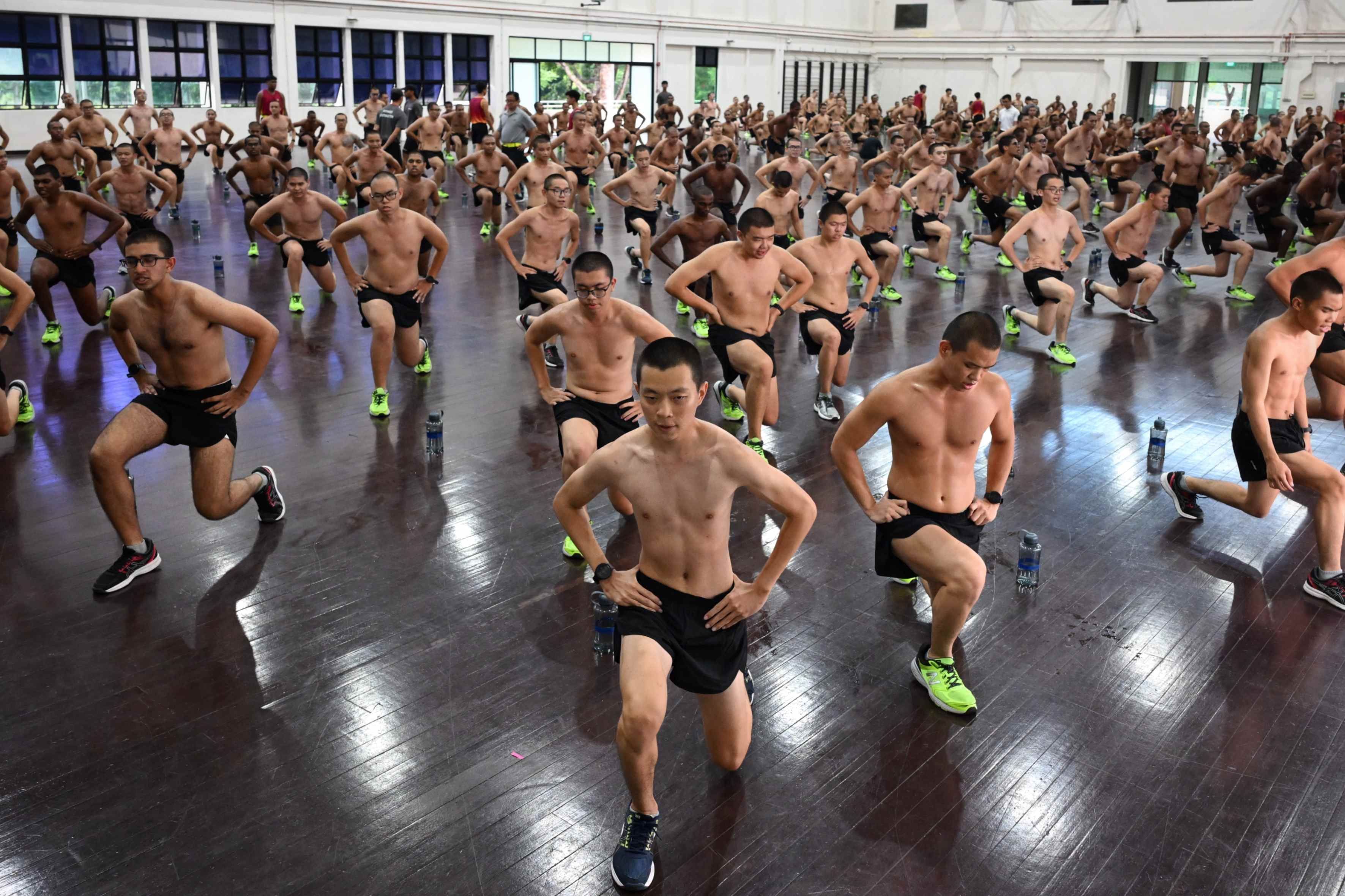 A group of men exercise at the Basic Military Training Centre on Pulau Tekong.