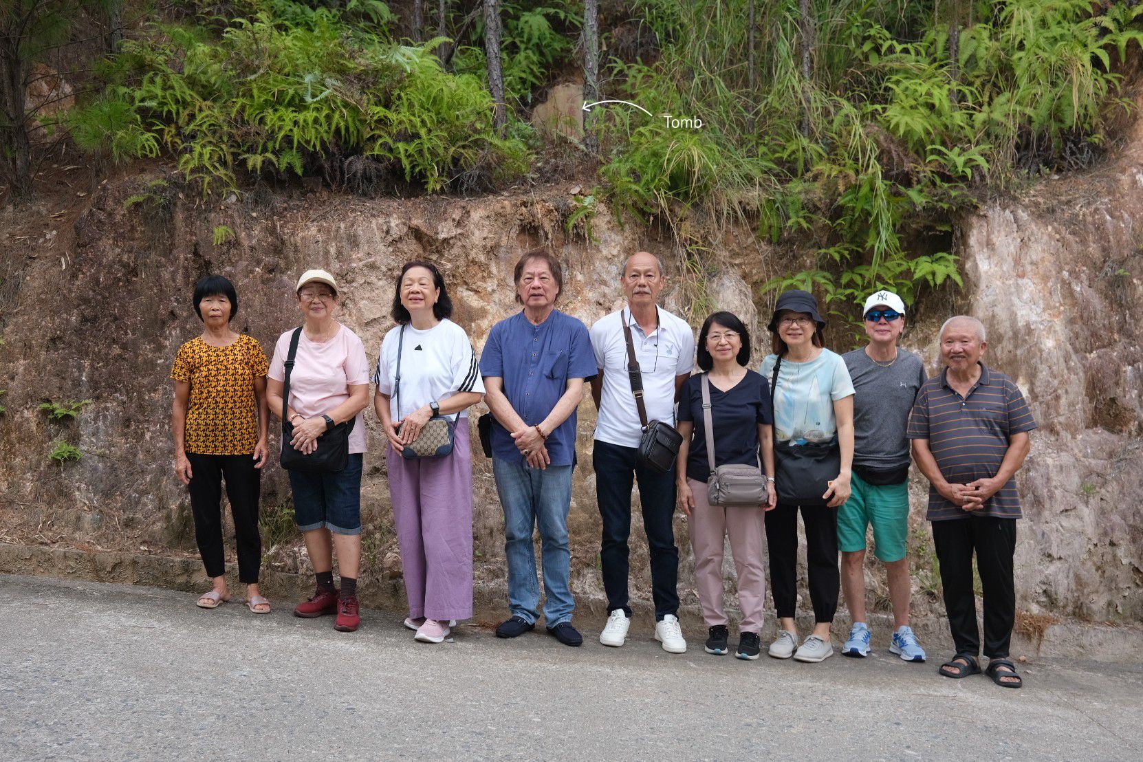 Mr Aw (centre), with his siblings and relatives from China, standing in front of his great-grandfather’s tomb in Anxi during a visit in September 2025.