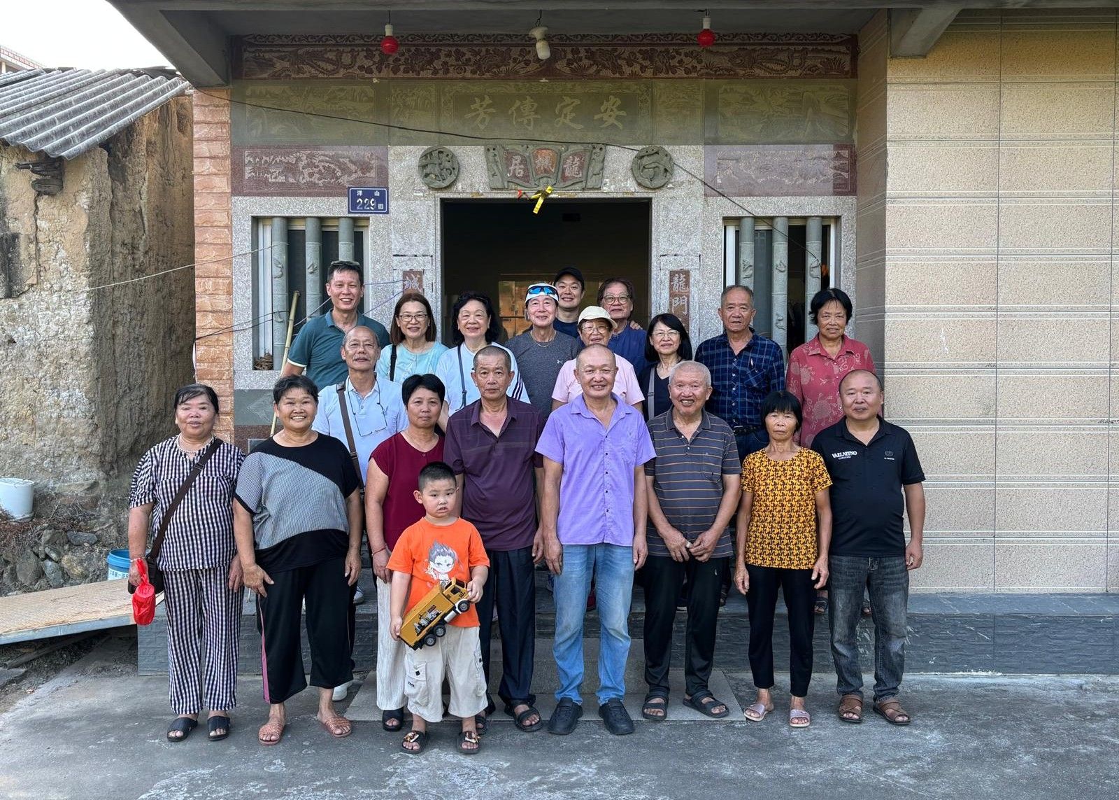 Mr Hu Xinmin, in a light purple shirt, with his distant relatives from Singapore during a visit to their ancestral home in Zhiyang village, Anxi. They are joined by other members of the Hu family in China.