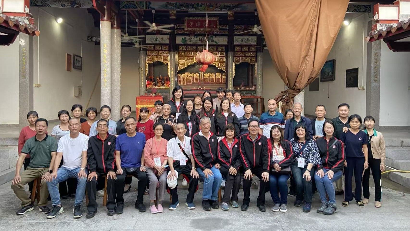 Mr Or Teck Seng (seated, fourth from right) with relatives during a more recent visit in 2023. He has made over 30 trips there.