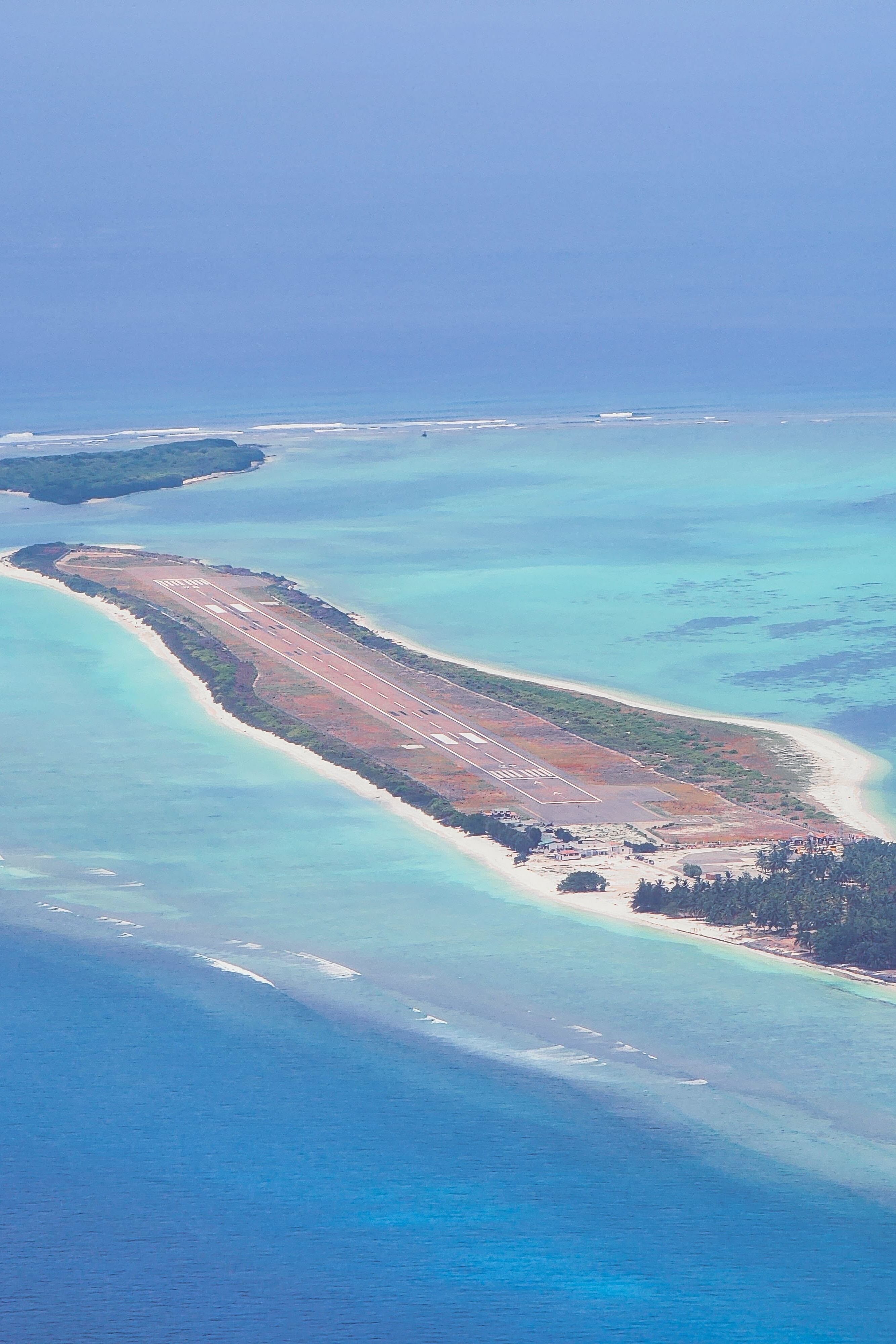 An aerial photo of the island where the Agatti Airport’s runway can be clearly seen.