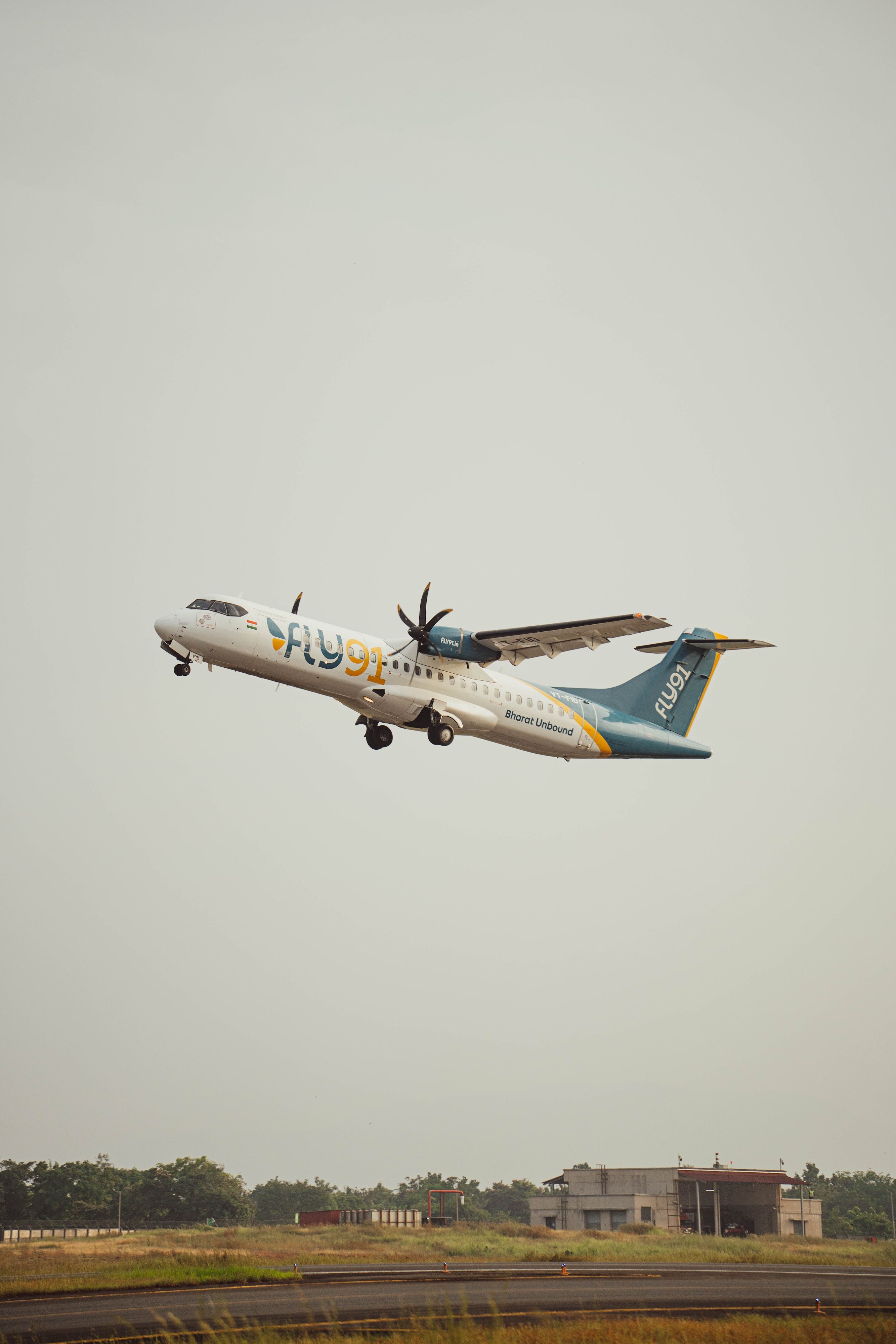 Fly91’s turboprop aircraft is in the air at a small airport in India.