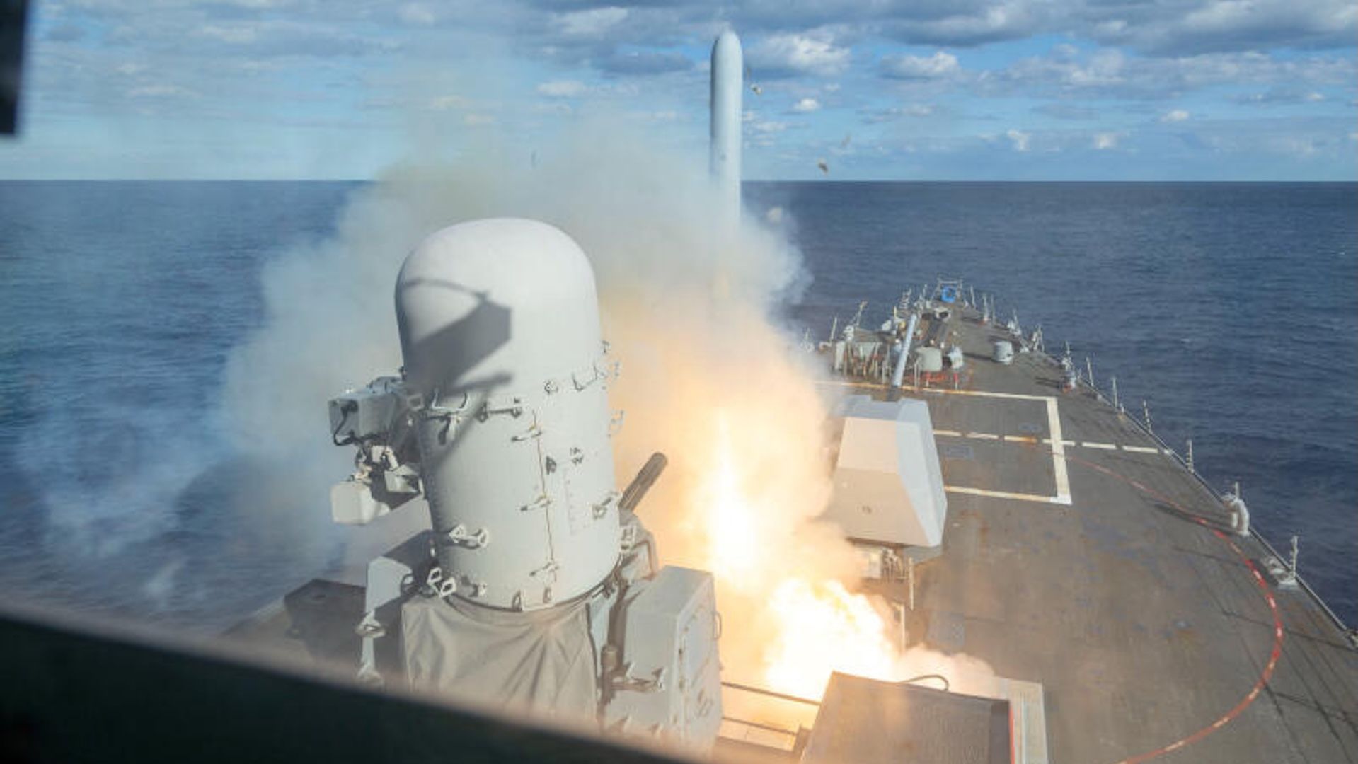 A missile fires from a U.S. Navy warship at sea, in a still image released by U.S. Central Command.