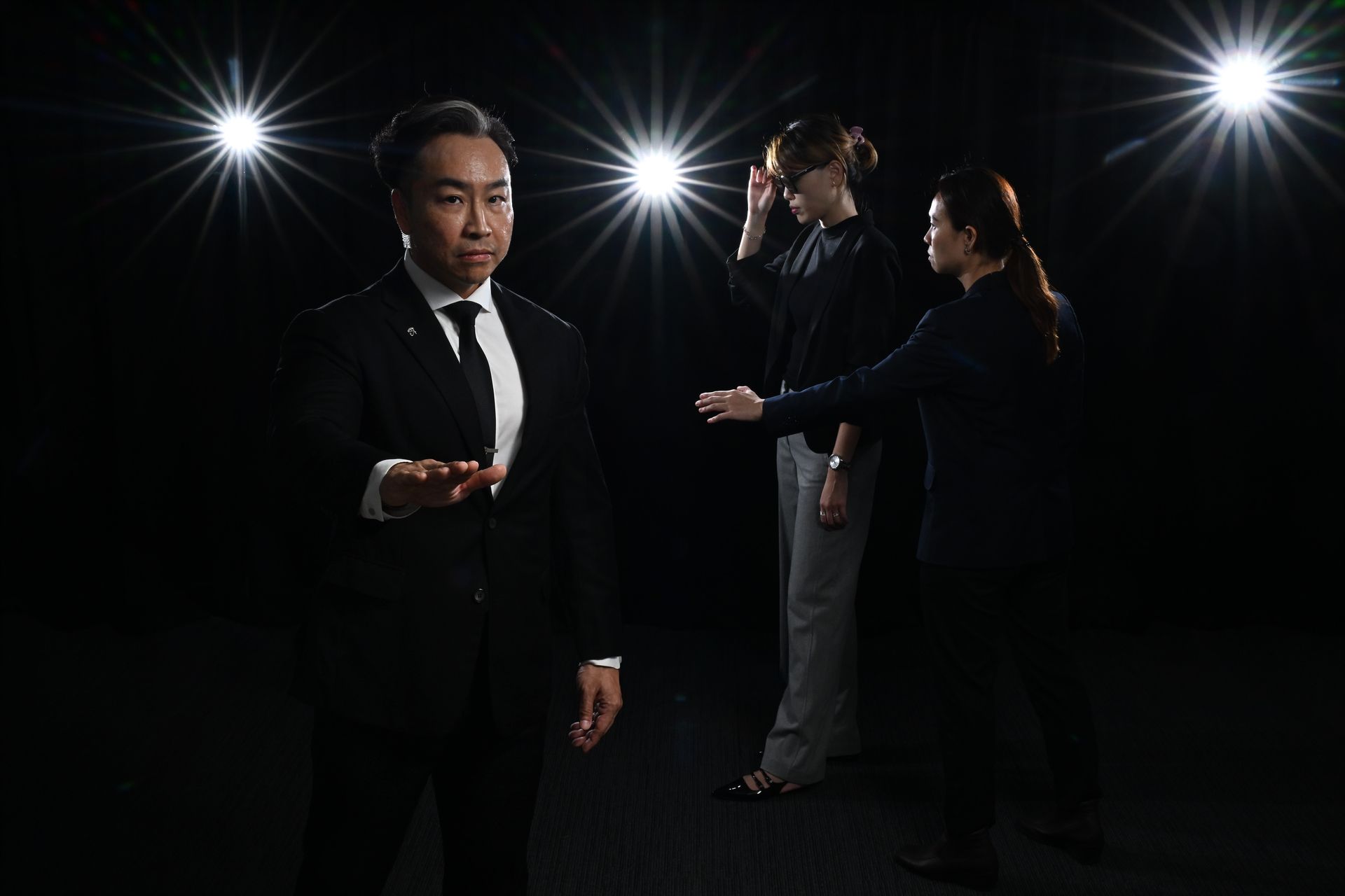 Tjen and his colleague Ng Li Bing demonstrating the work involved in executive protection in this posed photo. They started their careers with the police, providing security for prime ministers and presidents.