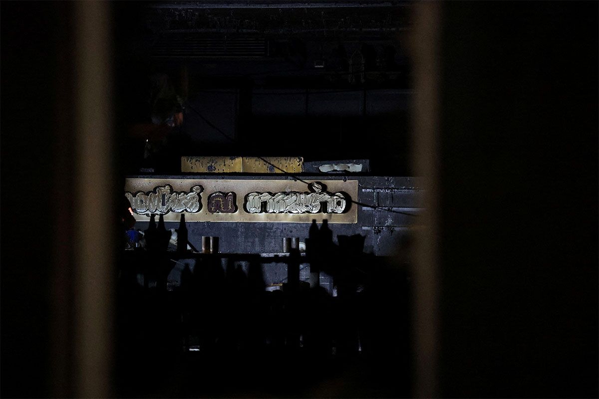 A burnt sign at the site of a deadly fire at a pub in Bangkok, Thailand, July 13, 2026.