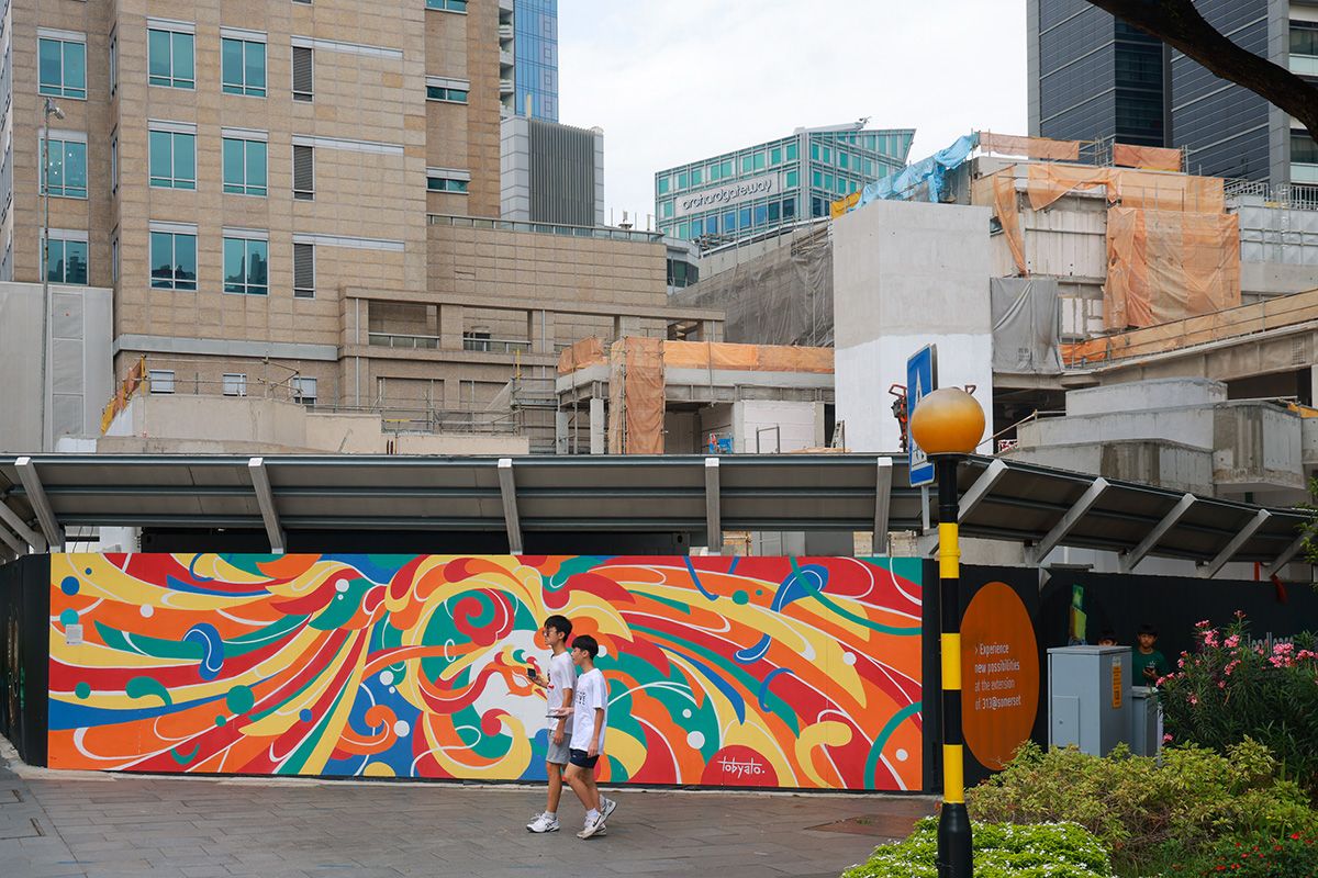 Two youths walking past the Live Nation construction site in Orchard Road on July 11, 2026.