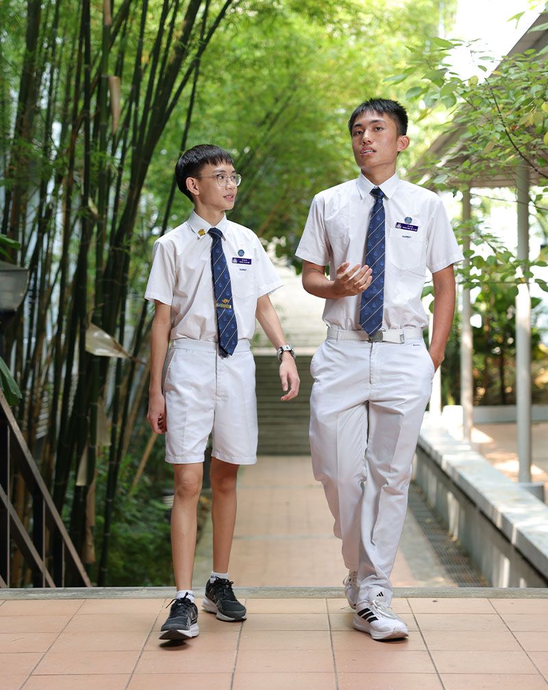 Photo of school leader students in uniforms at Maris Stella High School, highlighting the blue theme carried through their name tags.