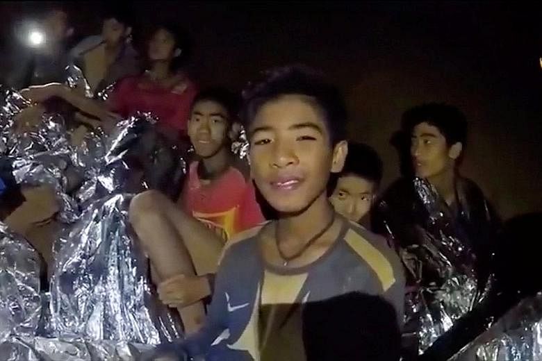 Divers from China helping with the rescue effort in the Tham Luang cave complex on Tuesday. The 12 boys and their football coach were found alive on Monday night.