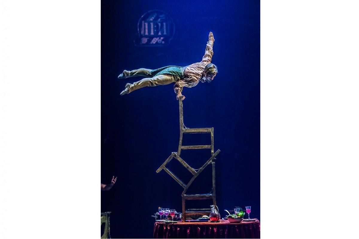Some of the death-defying acts include the Aerial Bicycle, where a girl dangles on a bike in the air; the Upside Down World (above), where a man is perched on the back of a chair atop a pile of chairs; and the Rola Bola act, where an acrobat balances on a